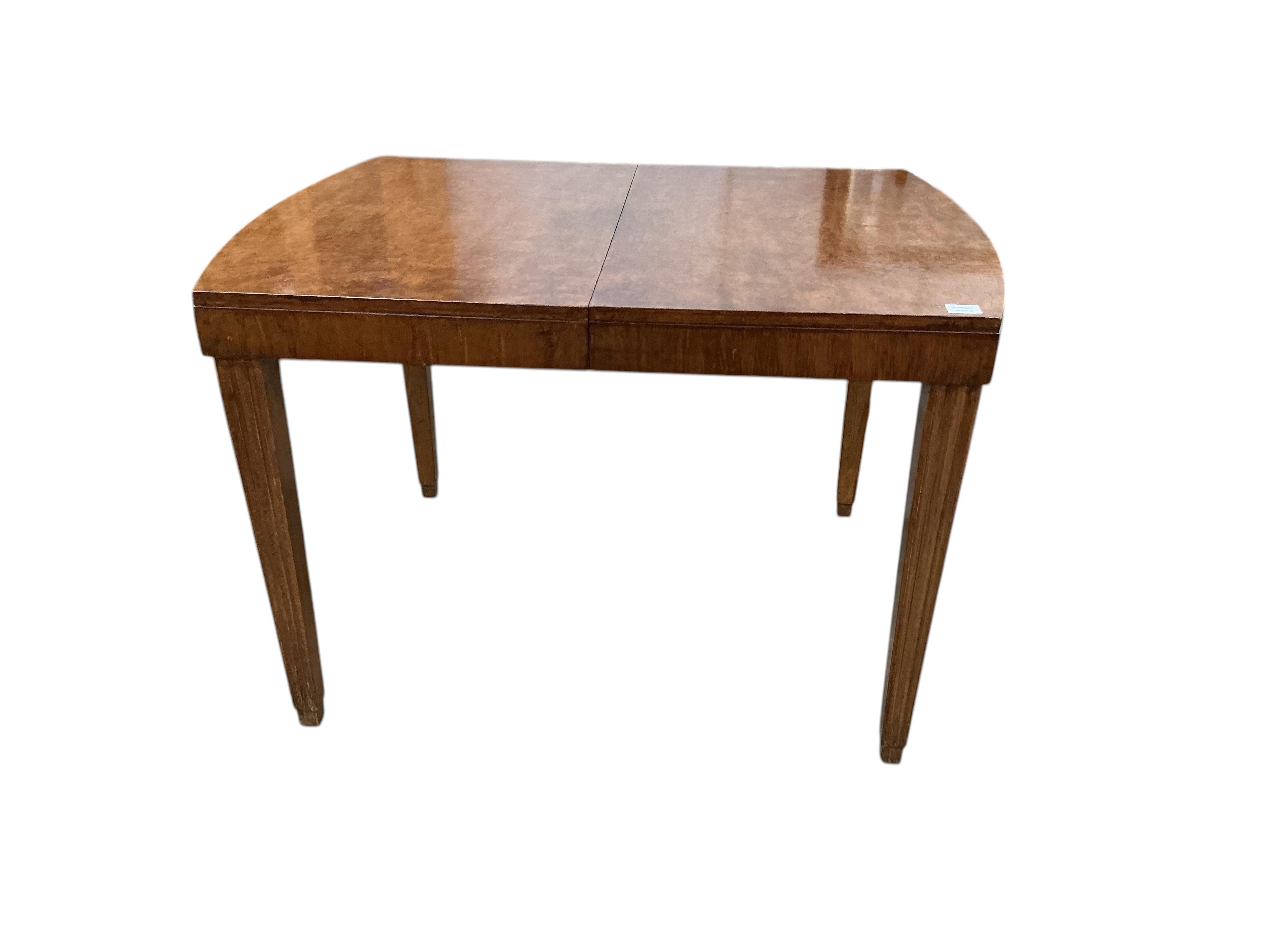 An Art Deco style beech and birds eye maple extending dining table, width 110cm, depth 84cm, height 75cm, and six similar chairs, two with arms